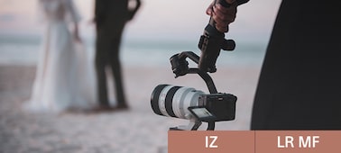 Usage image showing photographer with camera mounted on a gimbal, with a newly married couple in background bokeh