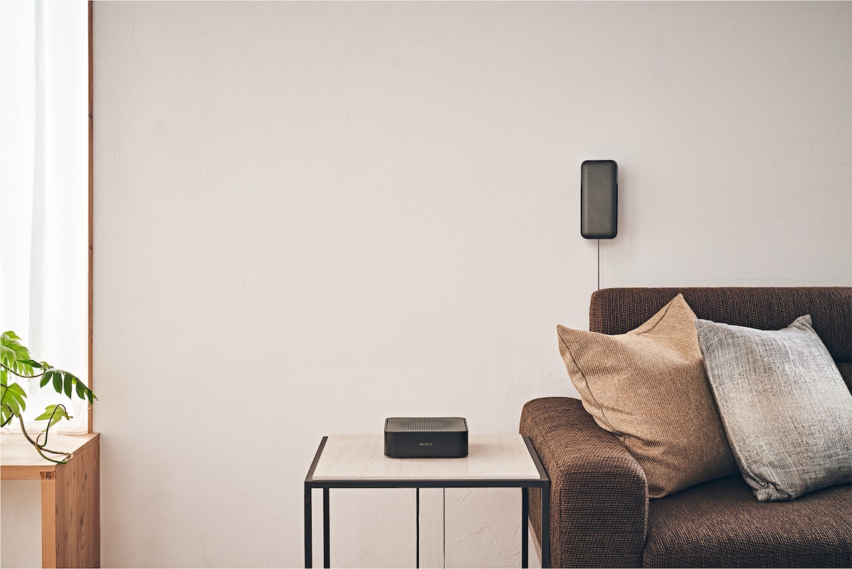 HT-S40R receiver on a desk next to a sofa