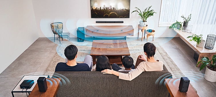 Family watching TV and the HT-S40R in a living room